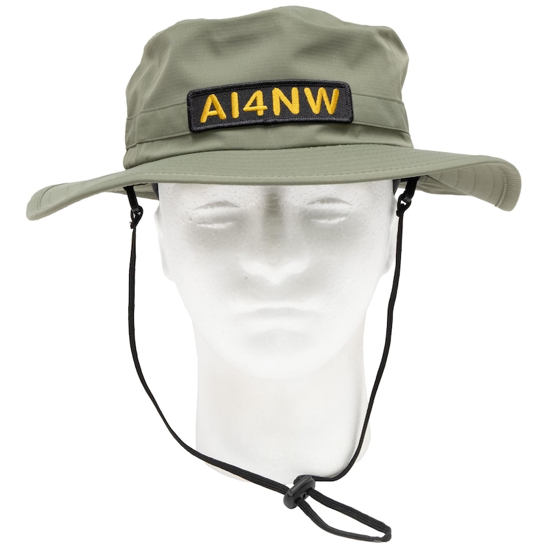 Olive boonie hat with black and gold personalized call sign patch
