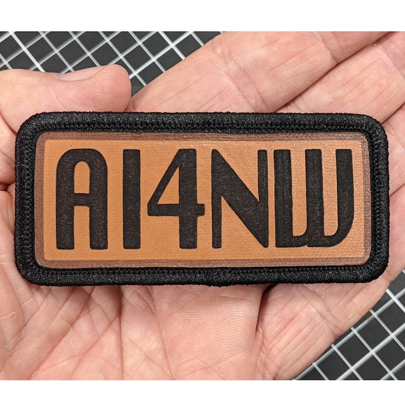 AI4NW leather call sign patch with black fabric border