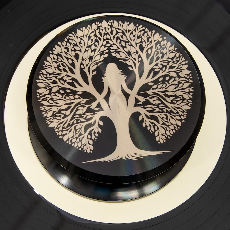 Tree of Life artwork engraved on a black record weight